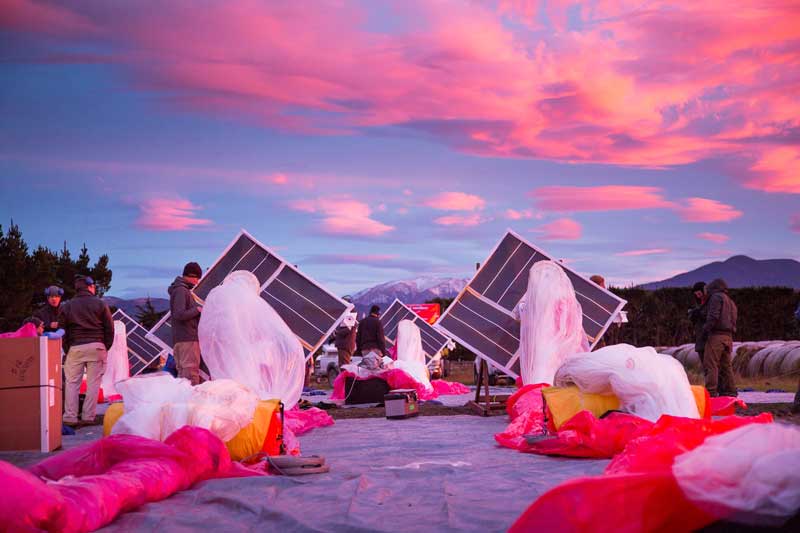 The Project Loon team prepares solar panels, electronics, and balloon envelopes for launch as the sun rises in New Zealand.  Photo courtesy of Project Loon / X.