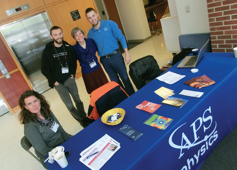 Parsons (black shirt) with the people at the APS info table. 