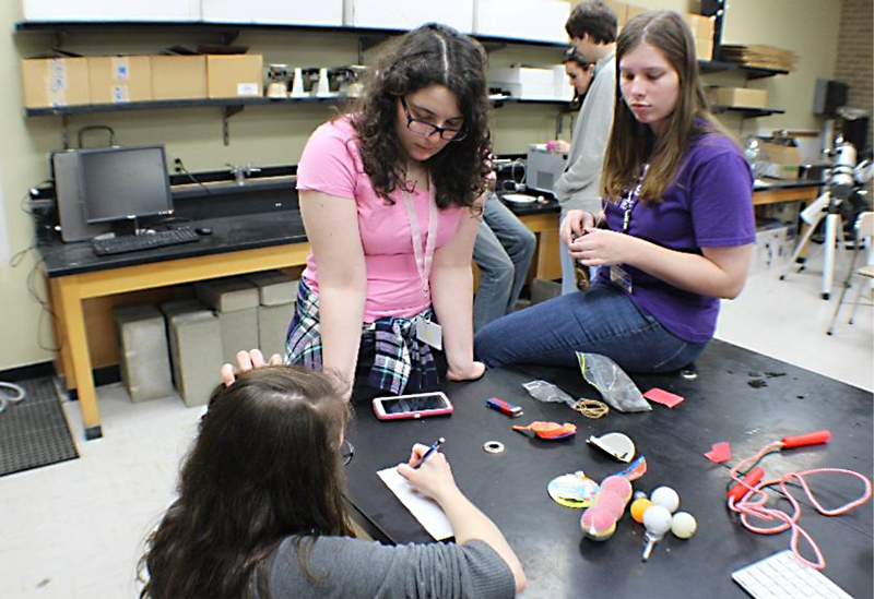 Students plan their demo for the demo competition.