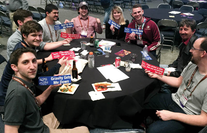 Showing off bumper stickers at the Student Awards Banquet.