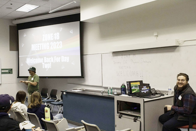 Zone Councilor, Dr. Chad Kishimoto, warms up the crowd on Saturday, with McGwire Herbert, president of the Cal Poly Pomona chapter, looking on.