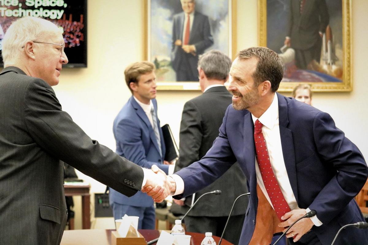 Congressman Dr. Bill Foster (D-IL) shaking hands with minority witness Mr. Rob Gramlich