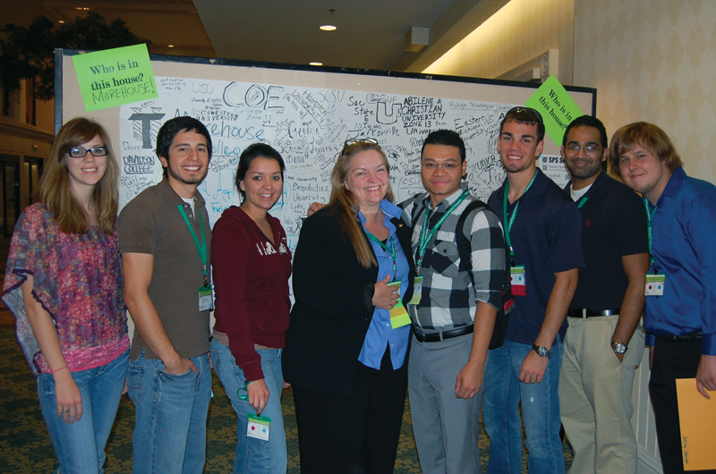 Sigma Pi Sigma Director Toni Sauncy (center) is flanked by her former students from Angelo State University at the 2012 Quadrennial Physics Congress. Photo by Liz Dart Caron.