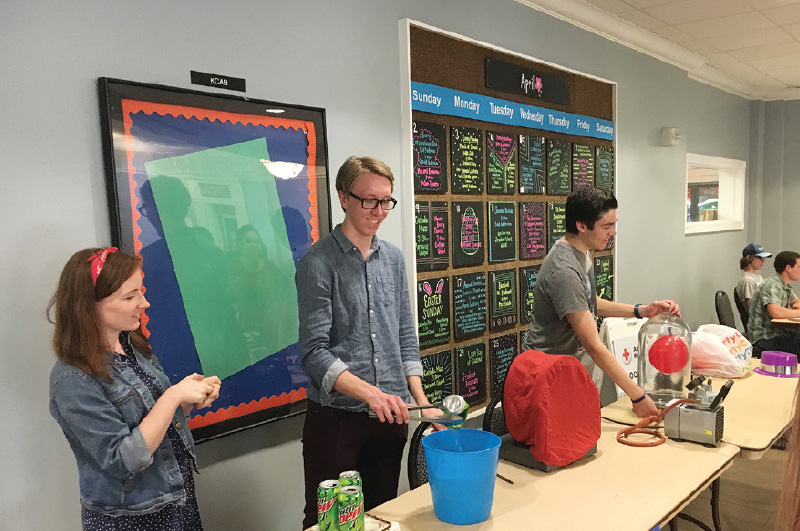 Members of the Berry College SPS and Sigma Pi Sigma chapters show off science demonstrations at the science magic show. Photo by Andrew Lockhart.