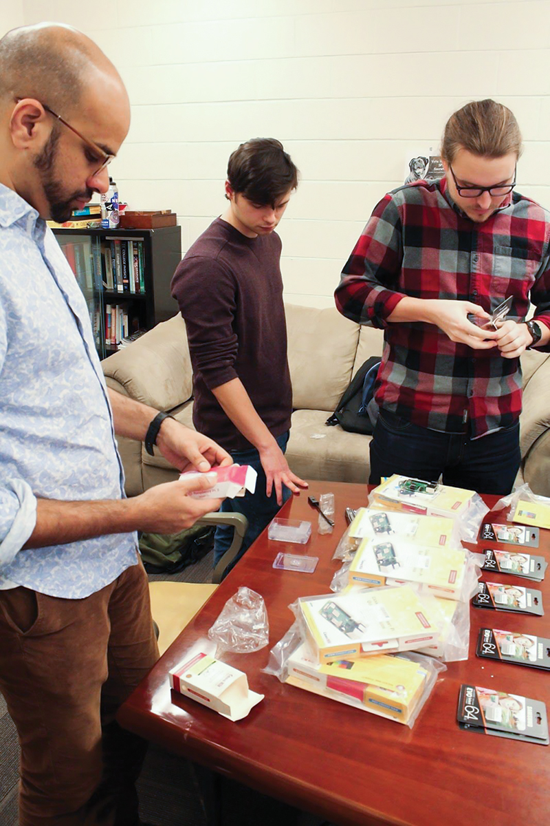 Team members prepare to set up the nine Pis. Photo by Dany Waller.