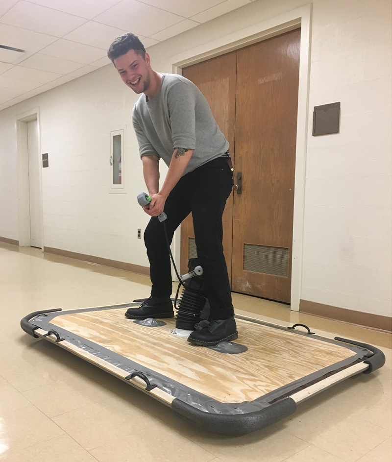 Project lead Evan Main tests out the big hovercraft. Photo by Anna Murphree.