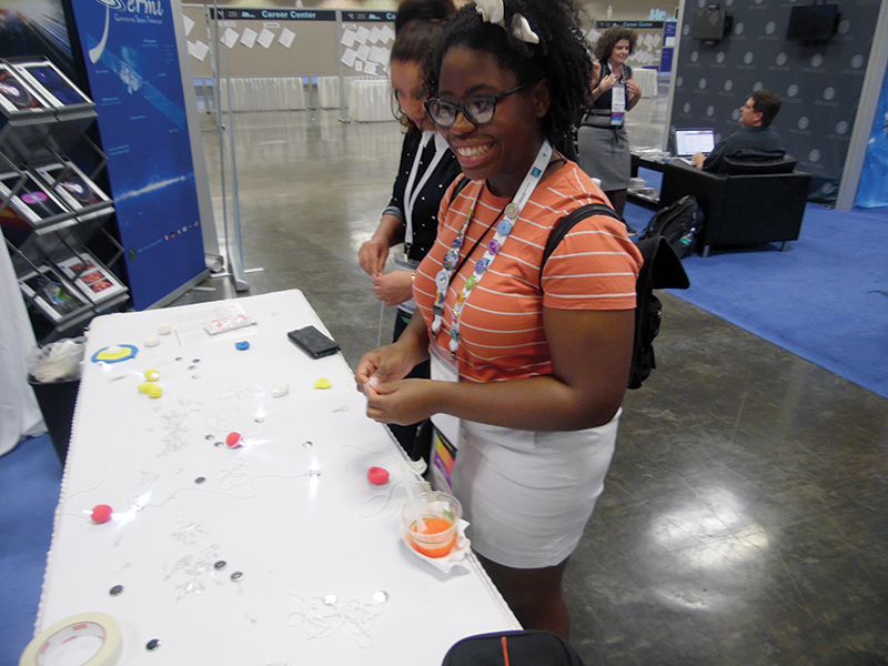 Morgan Waddy makes a clay pulsar. Photo by Levi Schult.