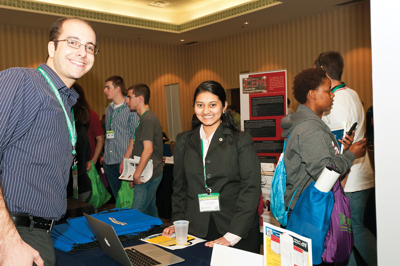 Yashashree Jadhav (right) learns more about GradSchoolShopper from Exhibitor Daniel Greenberg.