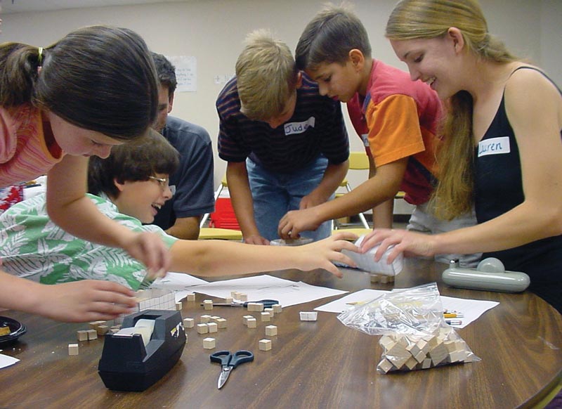 Lauren Zarandona demonstrates activities from the 2002 SPS SOCK at the Angelus Academy. Photo by Liz Dart Caron. 