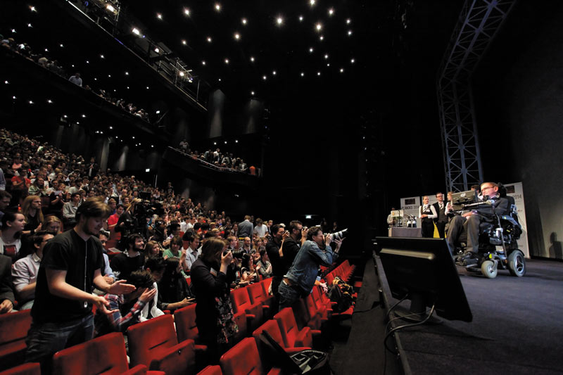 Stephen Hawking on stage at the IAPS-hosted PLANCKS competition in 2014. Photo courtesy of Amanda Landcastle.