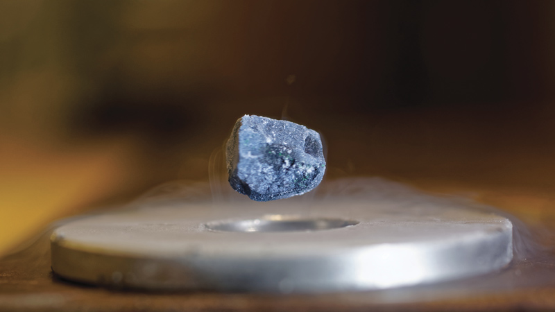 A magnet levitates above a piece of superconductor cooled to -196°C. Photo by Julien Bobroff, Frederic Bouquet, Jeffrey Quilliam, LPS, Orsay, France.