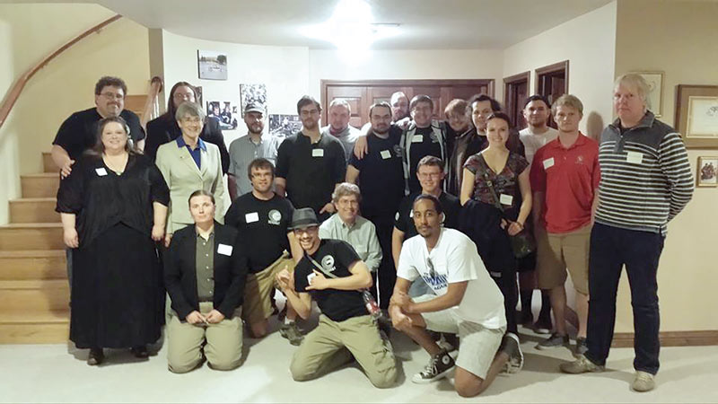  Zone meeting attendees pause for a group photo at their  Saturday dinner.