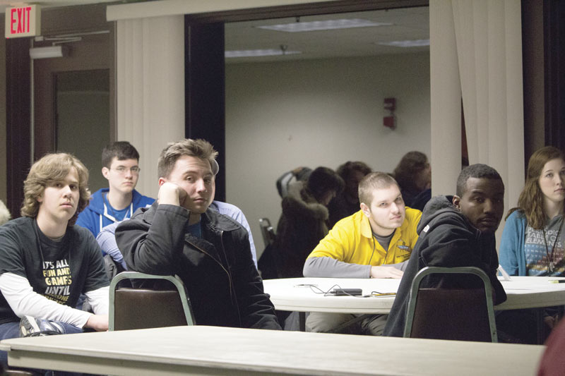 Attendees present posters and participate in other activities at the Zone 8 meeting. Photos by Brandon Barker.