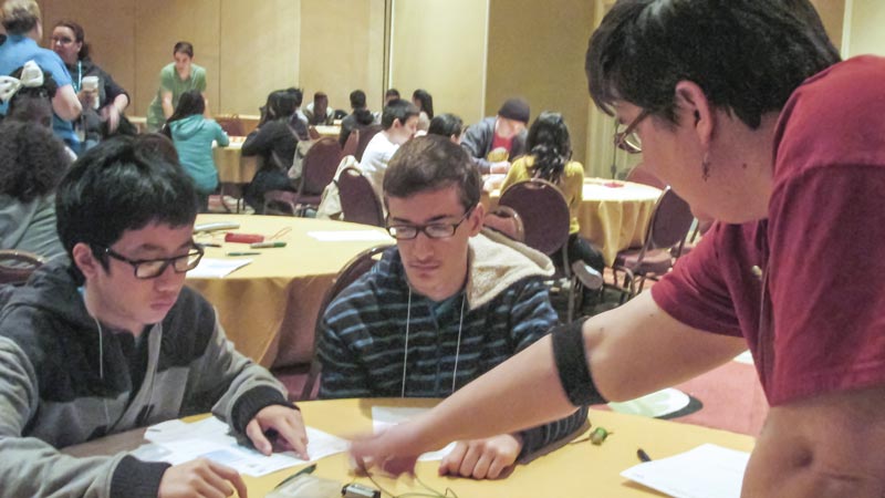 SPS president DJ Wagner participates in the Students Exploring Engineering and Science (SEES) outreach event at the 2014 American Association of Physics Teachers (AAPT) Winter Meeting in Orlando, FL. This program, sponsored by AAPT and the Society of Physics Students, provides 100 minority, low-socioeconomic students with the opportunity to engage in three hours of hands-on science activities during the AAPT Winter Meeting each year. Photos courtesy of the American Institute of Physics.