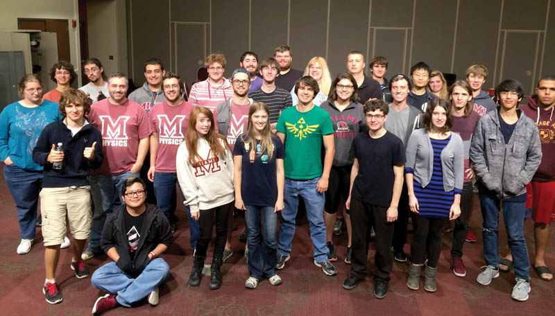 The Miami University of Ohio SPS chapter, the Astronomy Club, and the Strategic Game Club pose for a group photo 21 hours into a 24-hour board game marathon. This event, part of the National Extra Life Charity Drive, helps support Cincinnati Children’s and other Children’s Miracle Network hospitals. Photo courtesy of Amber Williams.