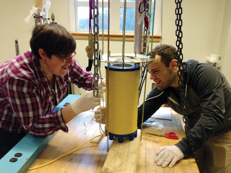 Dr. Long installing the solenoid for the University of New Hampshire’s new DNP polarizer. Photo Courtesy of University of New Hampshire.