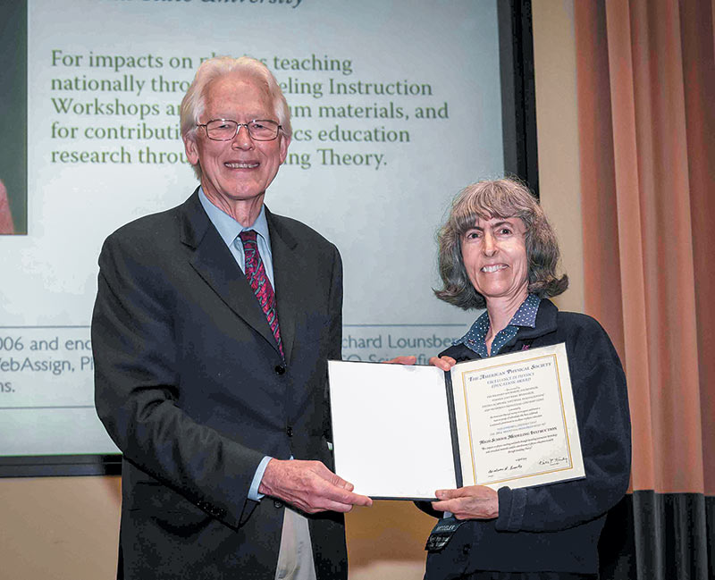 High School Modeling Instruction was recognized with the 2014 Excellence in Physics Education Award of the American Physical Society (APS). The award was presented to Jane Jackson (right), David Hestenes, and Colleen Megowan by then APS president Malcolm R. Beasley (left) at an APS meeting. Photo courtesy of the American Physical Society.