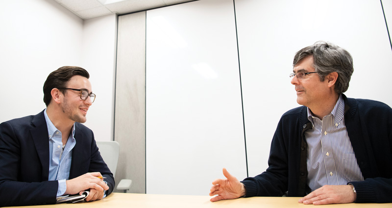 Nicholas Huntoon (left) interviews LANL director Thomas Mason. Photo courtesy of Los Alamos National Laboratory.