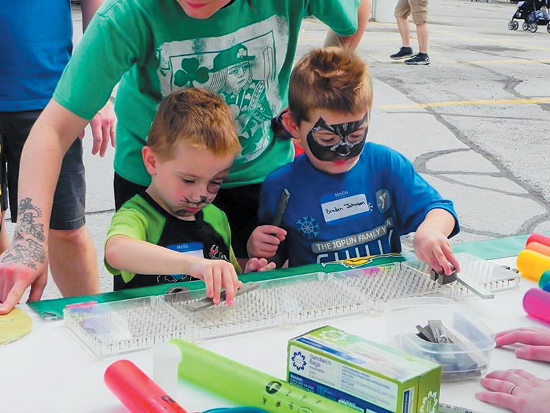 Children at NICU Freeman watch the alignment of magnetic field lines as they move the magnets.