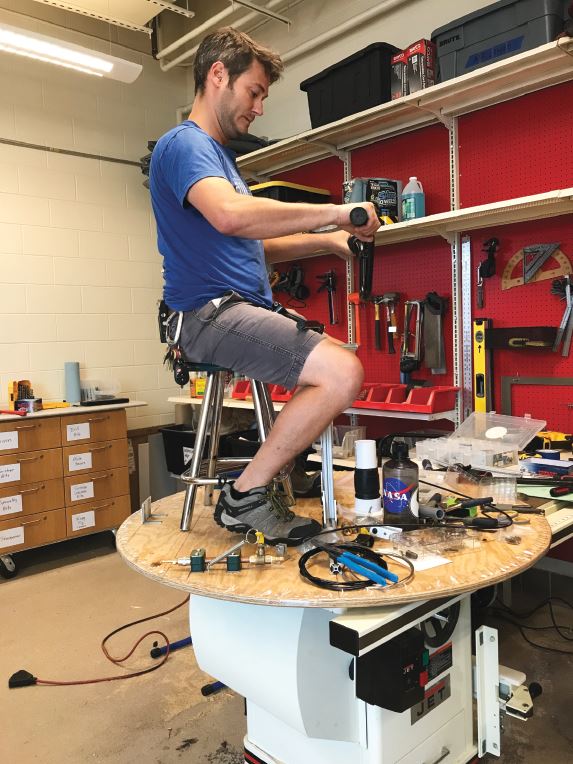 Bryan Gaither testing the handlebars of the Mark III hovercraft.  Photo courtesy of Bryan Gaither.