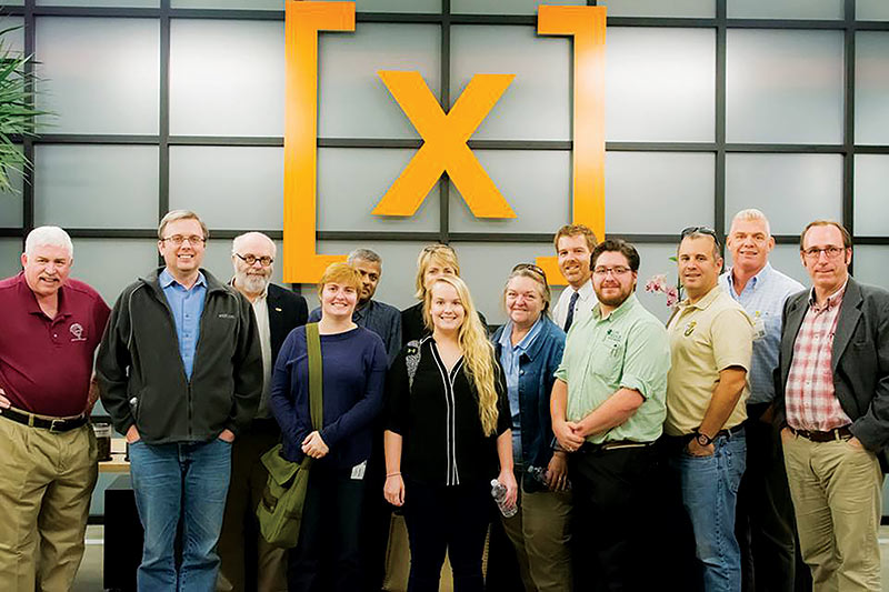 The 2016 PhysCon Planning Committee checking out tour locations in San Francisco with the author front row center.  Pictured at Google X. Photo courtesy of Tracy Schwab.