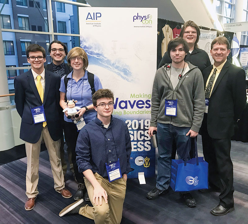  SPS physics majors at PhysCon 2019 with advisor Dr. Peter  Sheldon (right).