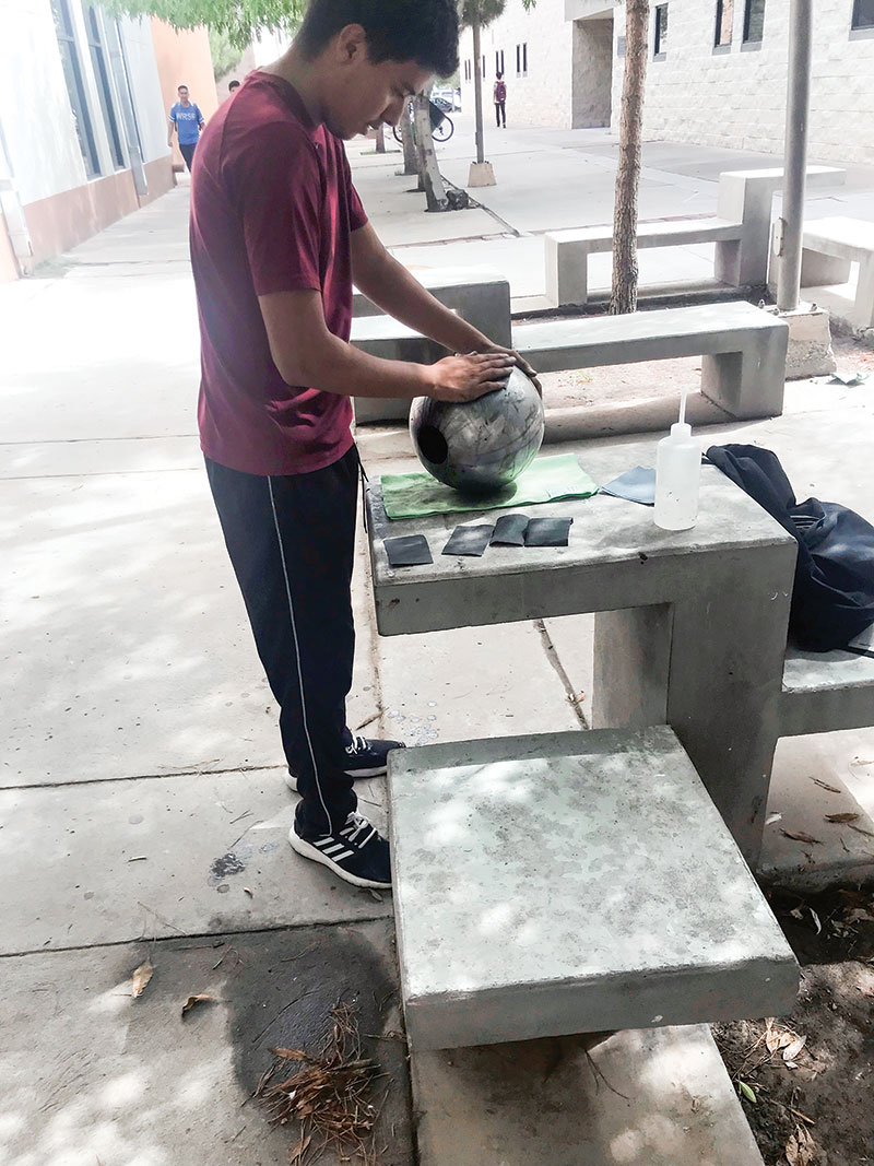 Julio López Ibarra sands a mass in preparation for testing.