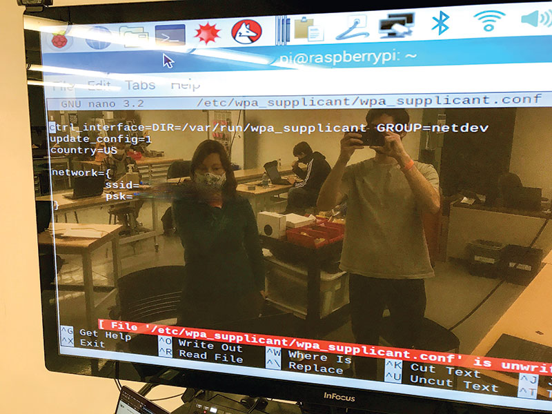  a Velodyne rotating LiDAR sensor, an inertial measurement unit (IMU), and a Raspberry Pi. In this image, students are working from multiple computers to set up the internet for the Raspberry Pi and learning how to use a SLAM (simultaneous localization and mapping) algorithm in a COVID-safe environment. Photo by Trevor Gilkerson.