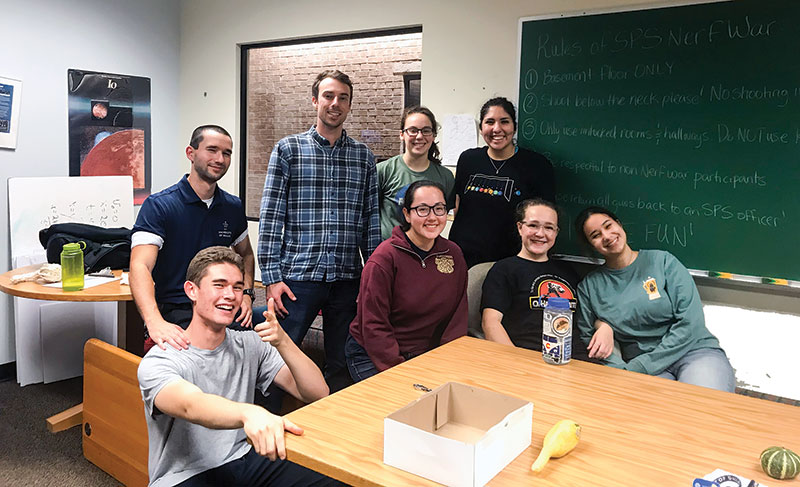 Nerf War participants gather in the physics lounge to prepare for the next game. Photo by Reagan Miller.