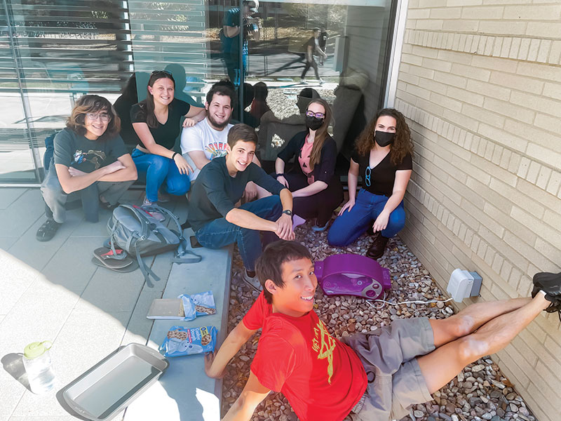 SPS members enjoy time outside the physics lounge while making cookies in an Easy-Bake  Oven. Photos courtesy of  Elizabeth Buchheim.