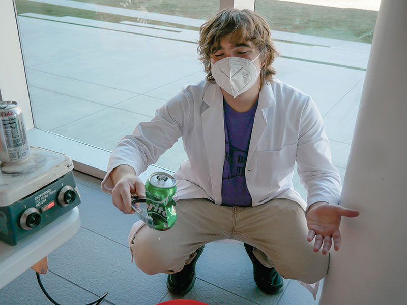 Keenan Myers shows students how to crush an aluminum can using the pressure of our atmosphere and changing temperatures. Photos courtesy of the chapter.