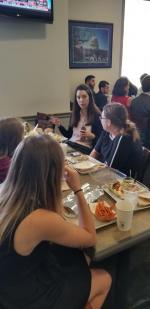 Dr. Sara Barber with some of the SPS Interns over lunch, teaching them about her role in the Research &amp; Technology Subcommittee Staff