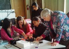 Rosell works with students at an Expanding Your Horizons in Math and Science conference intended to nurture girls' interests in these subjects. Photo courtesy of Sharon Rosell.