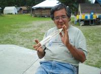 Edwin shows off a rocket model. Photo courtesy of Leona Long. 