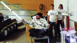 Jacob Dansie (left) uses “the Force” thanks to a Tesla coil, with Phil Lundgreen (middle) and Darren McKinnon (right) observing. Photo courtesy of Ben Pound.