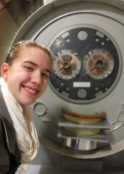 The author takes a selfie with a quadrupole magnet at the CERN museum near Geneva, Switzerland. Photo courtesy of Nicole Johnson.