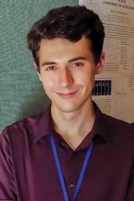 Louis Varriano in front of his poster presentation at ICPS. Photo courtesy of Louis Varriano