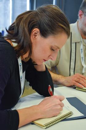 A Talk Climate Institute attendee works on her story. Photo courtesy of Climate Generation.