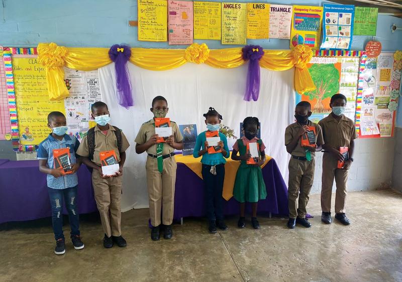 Students from the community of Burnt Savannah in Westmoreland, Jamaica, pose with tablets that will be used for online learning. Photos and images are courtesy of the corresponding chapter.