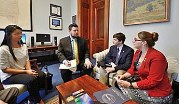 Aman Gill (left), Courtney Lemon (right), and Simon Patané (second from right) meet with John Trey Smith (staffer for Kirsten Gillibrand (D-NY). Photo by Ivan Petrov, president of AVS.